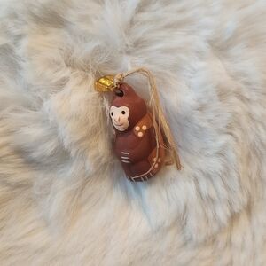 Brown chinese zodiac monkey good luck charm from Hokkaido shrine in Japan